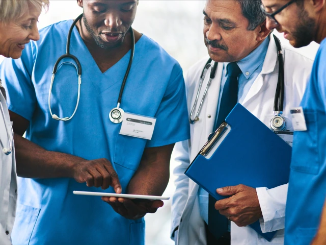 Healthcare Providers examining a chart